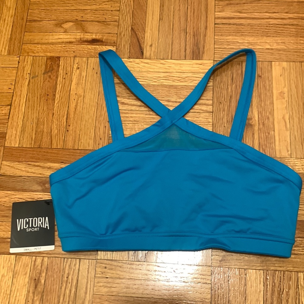 NWT Victoria Sport sports bra. A bright light blue. Size small.